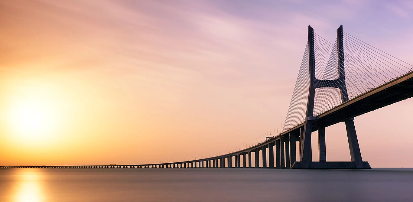Bridge across the water at dawn